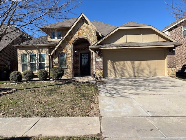 view of front of home featuring a garage and a front lawn