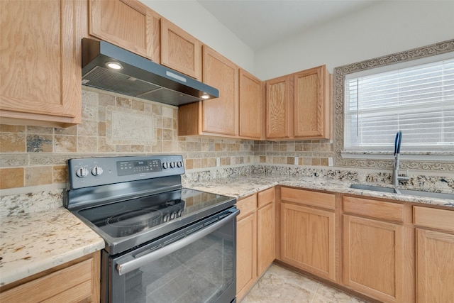 kitchen featuring range hood, tasteful backsplash, black electric range oven, sink, and light brown cabinets