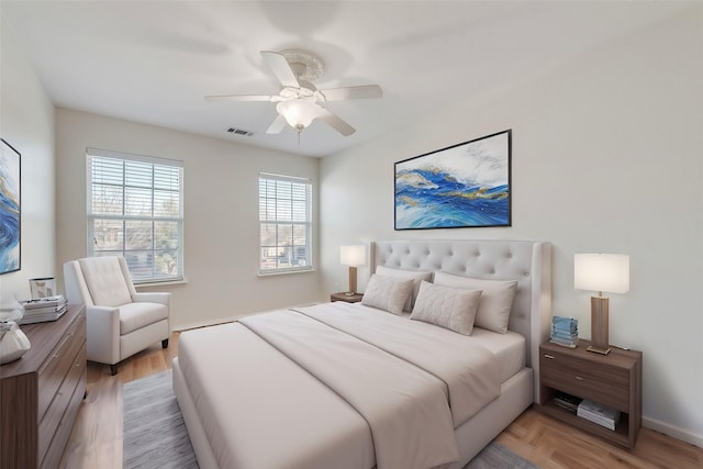 bedroom featuring wood-type flooring and ceiling fan