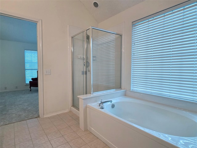 6464 Richmond Dr, Frisco, TX 75035 - bathroom with a bath, tile patterned floors, a shower stall, lofted ceiling, and baseboards
