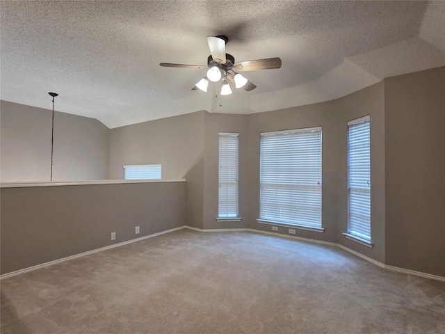 6464 Richmond Dr, Frisco, TX 75035 - carpeted spare room with a ceiling fan, baseboards, a textured ceiling, and vaulted ceiling