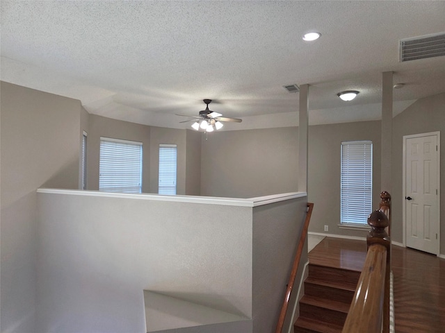 6464 Richmond Dr, Frisco, TX 75035 - corridor featuring an upstairs landing, a textured ceiling, baseboards, dark wood finished floors, and recessed lighting