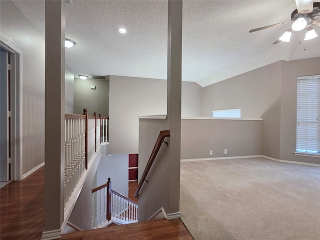 6464 Richmond Dr, Frisco, TX 75035 - staircase featuring a textured ceiling, carpet floors, a ceiling fan, baseboards, and lofted ceiling