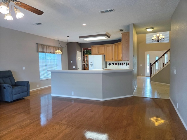 6464 Richmond Dr, Frisco, TX 75035 - kitchen with white refrigerator with ice dispenser, light wood-style floors, a ceiling fan, baseboards, and a textured ceiling