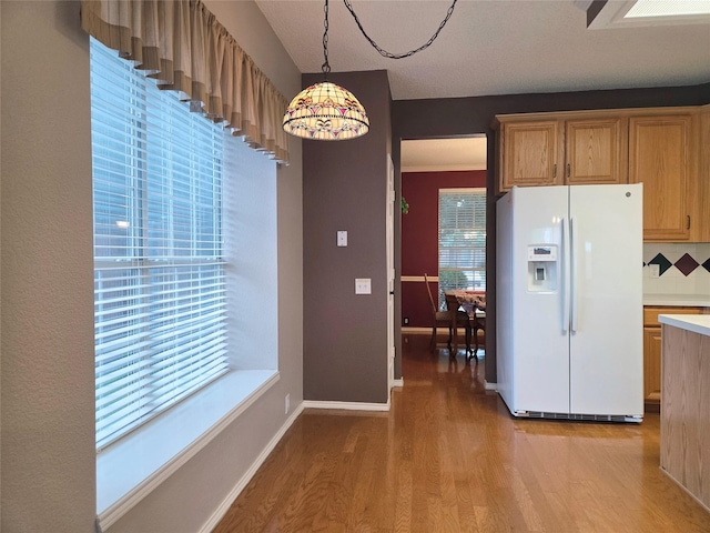 6464 Richmond Dr, Frisco, TX 75035 - kitchen featuring white fridge with ice dispenser, wood finished floors, light countertops, decorative light fixtures, and baseboards