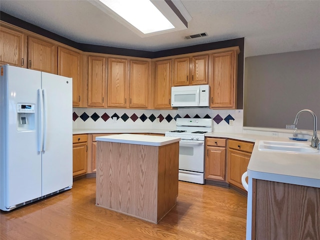 6464 Richmond Dr, Frisco, TX 75035 - kitchen featuring white appliances, a sink, light countertops, and backsplash