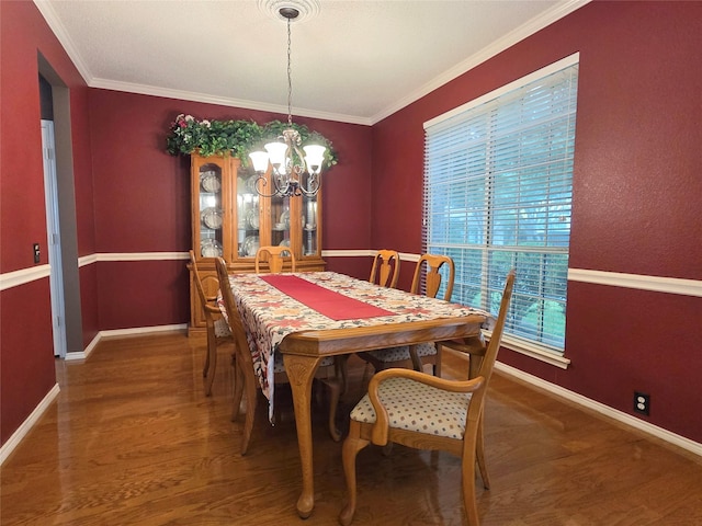 6464 Richmond Dr, Frisco, TX 75035 - dining space with wood finished floors, a chandelier, baseboards, and ornamental molding