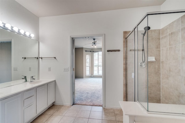 bathroom with vanity, tile patterned floors, and walk in shower