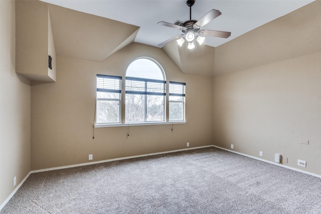 carpeted empty room featuring lofted ceiling and ceiling fan