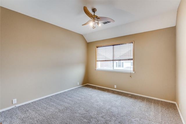 carpeted spare room with lofted ceiling and ceiling fan