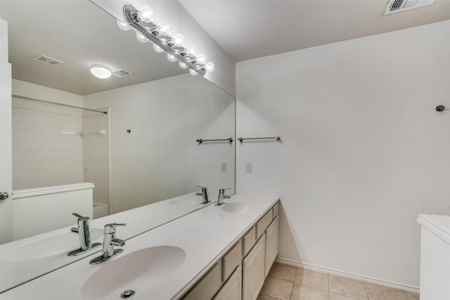 bathroom with vanity and tile patterned floors