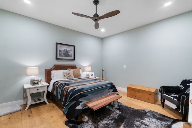 bedroom featuring ceiling fan and light hardwood / wood-style flooring