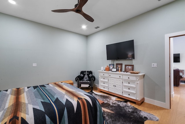 bedroom featuring ceiling fan and light hardwood / wood-style floors