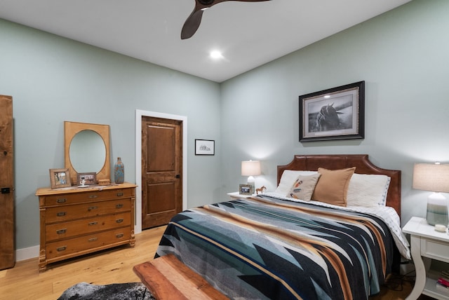 bedroom with ceiling fan and light wood-type flooring