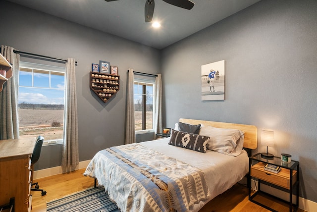 bedroom featuring ceiling fan and light wood-type flooring