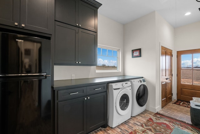 laundry area featuring cabinets and separate washer and dryer