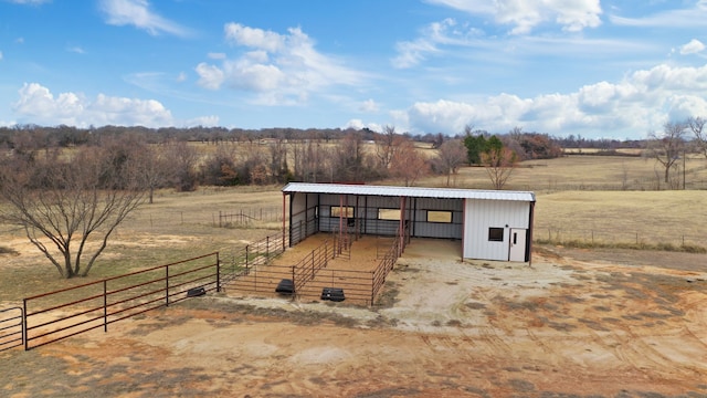 view of outbuilding with a rural view