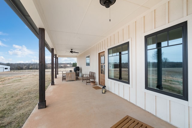 view of patio featuring ceiling fan