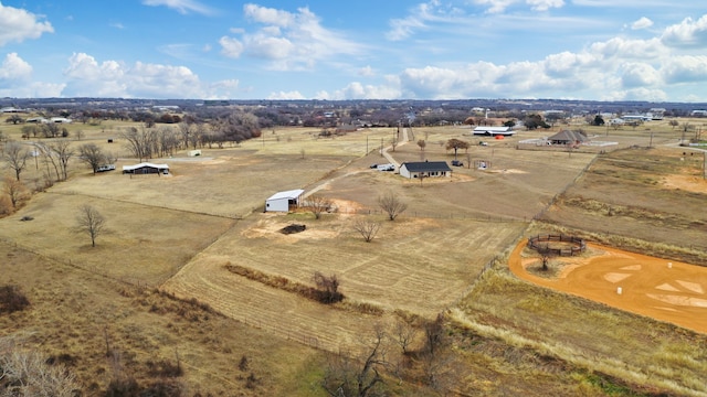 birds eye view of property featuring a rural view