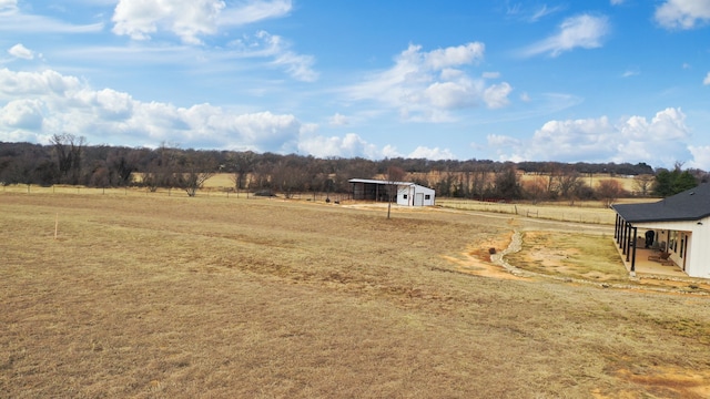 view of yard with a rural view