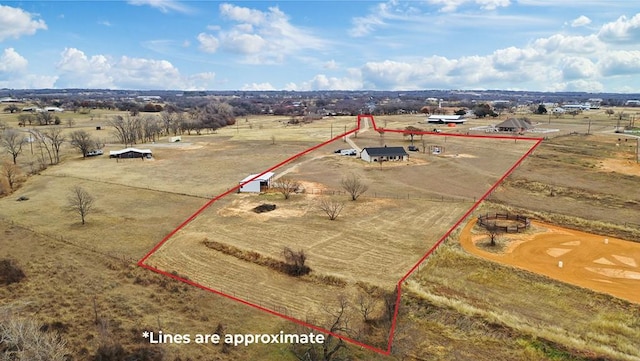 birds eye view of property with a rural view