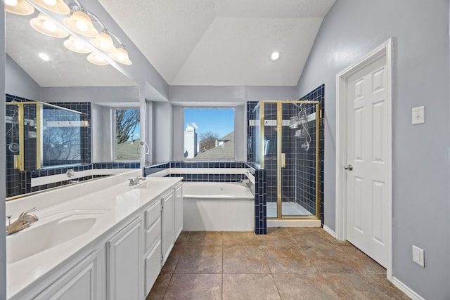 bathroom featuring vanity, shower with separate bathtub, vaulted ceiling, and a textured ceiling