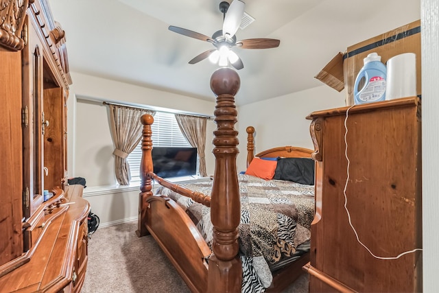 bedroom with dark carpet and ceiling fan