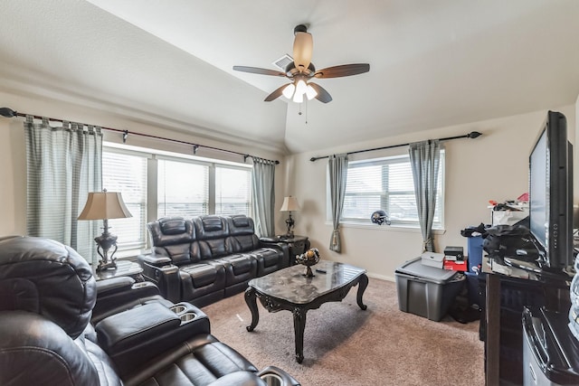 carpeted living room featuring ceiling fan and vaulted ceiling