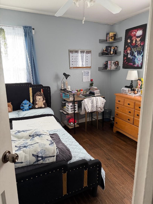 bedroom featuring ceiling fan and dark hardwood / wood-style floors