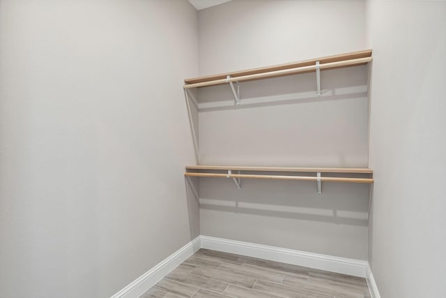 walk in closet featuring light wood-type flooring