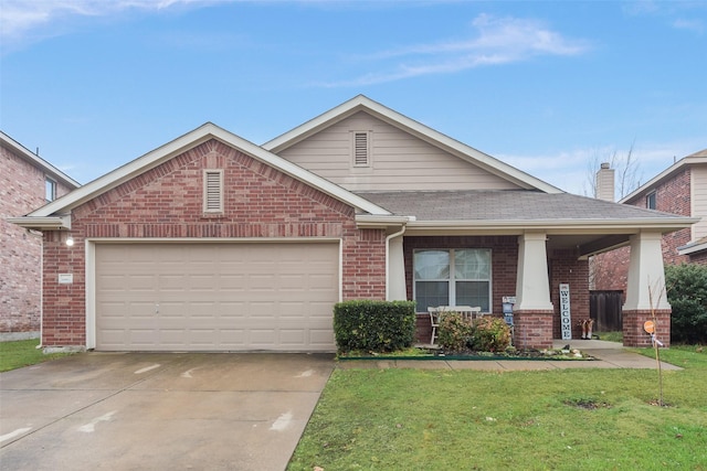 view of front facade with a garage, a front yard, and covered porch