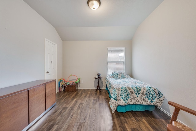 bedroom with dark hardwood / wood-style floors and vaulted ceiling