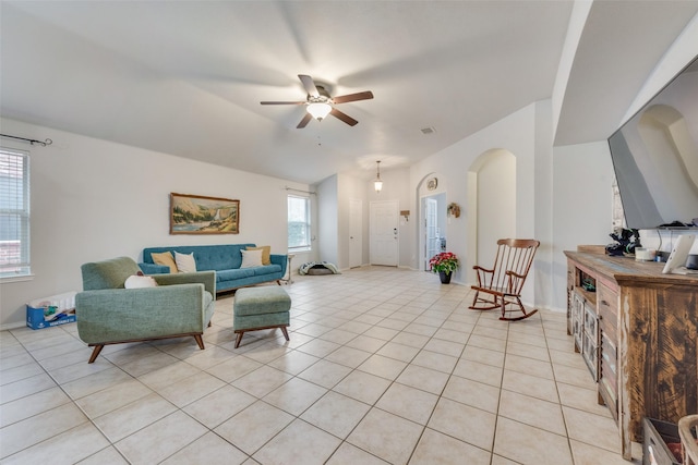 tiled living room featuring ceiling fan