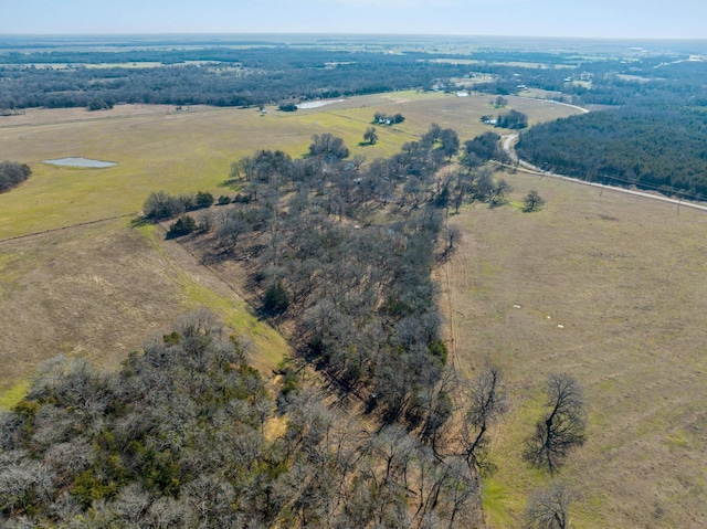 birds eye view of property featuring a rural view