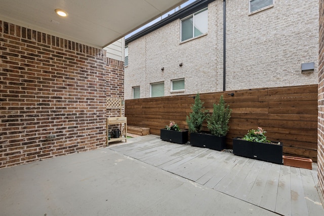 view of patio featuring fence