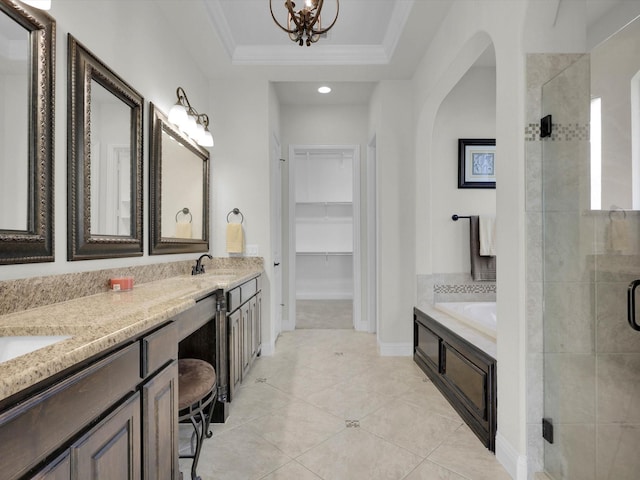 bathroom featuring separate shower and tub, ornamental molding, a tray ceiling, vanity, and tile patterned flooring