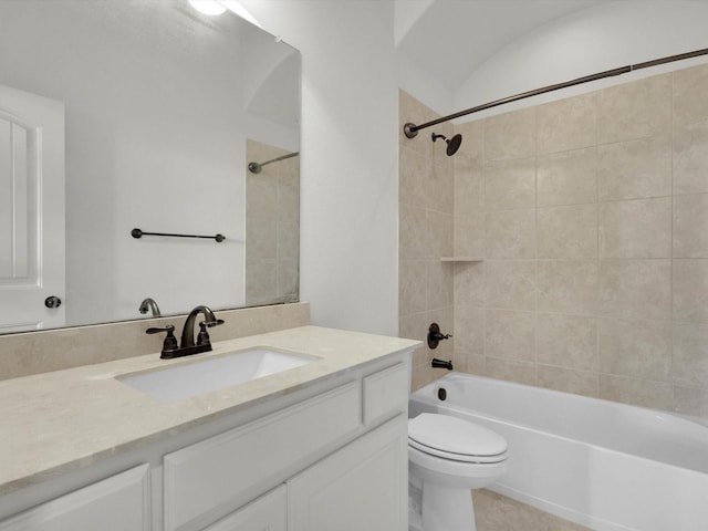 bathroom featuring shower / bath combination, toilet, vanity, and tile patterned floors