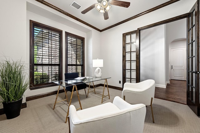home office with baseboards, a ceiling fan, visible vents, and a healthy amount of sunlight