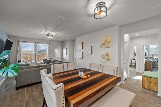 dining room with wood-type flooring