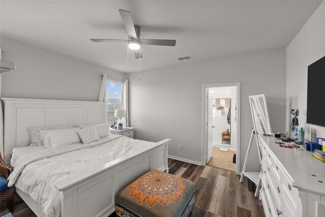 bedroom with ceiling fan and dark hardwood / wood-style floors