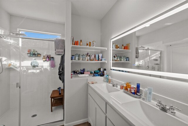 bathroom featuring vanity and an enclosed shower