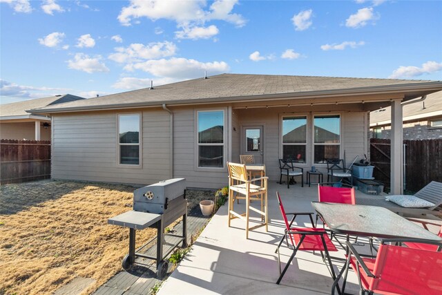 back of house with a patio