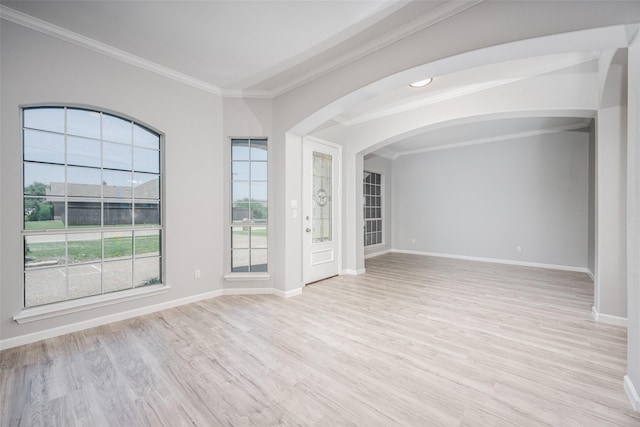 unfurnished room with crown molding and light hardwood / wood-style flooring