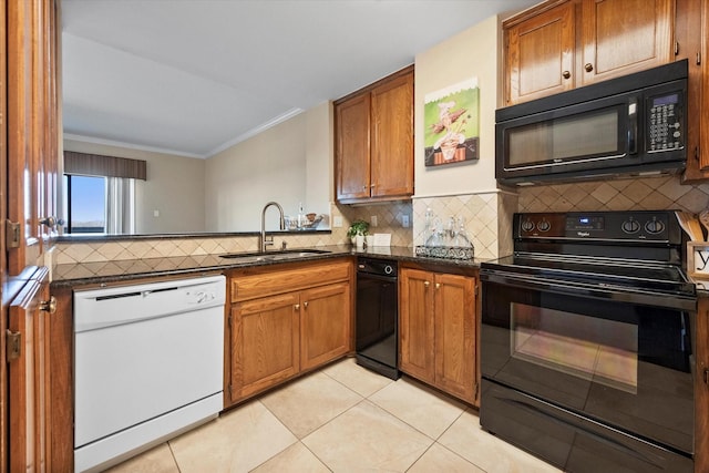 kitchen with crown molding, sink, backsplash, and black appliances