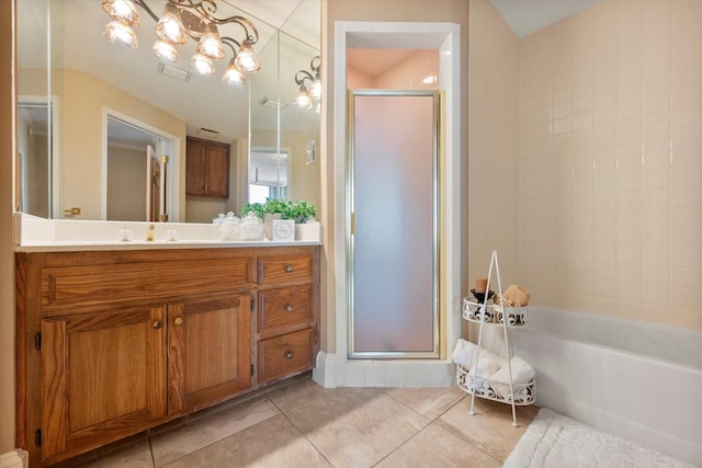 bathroom with vanity, tile patterned floors, independent shower and bath, and a chandelier