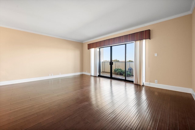 spare room with crown molding and hardwood / wood-style flooring