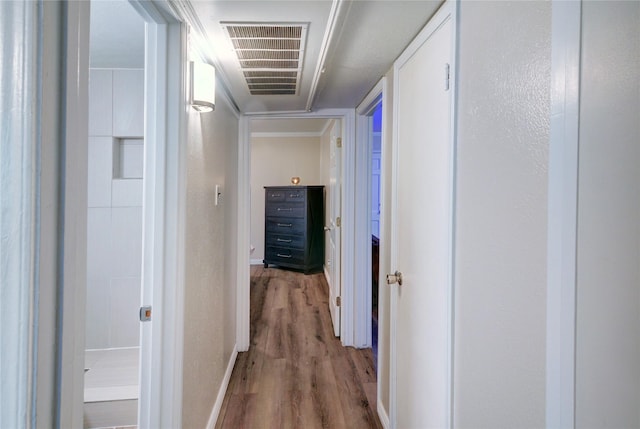 hallway featuring hardwood / wood-style flooring