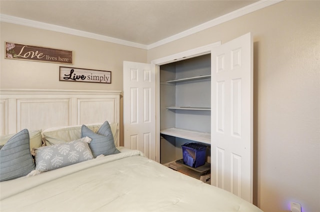 bedroom with crown molding and a closet