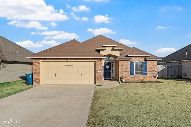 view of front of house with a garage and a front lawn