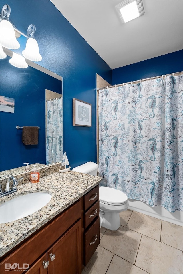 full bathroom with tile patterned flooring, vanity, shower / bath combo, and toilet